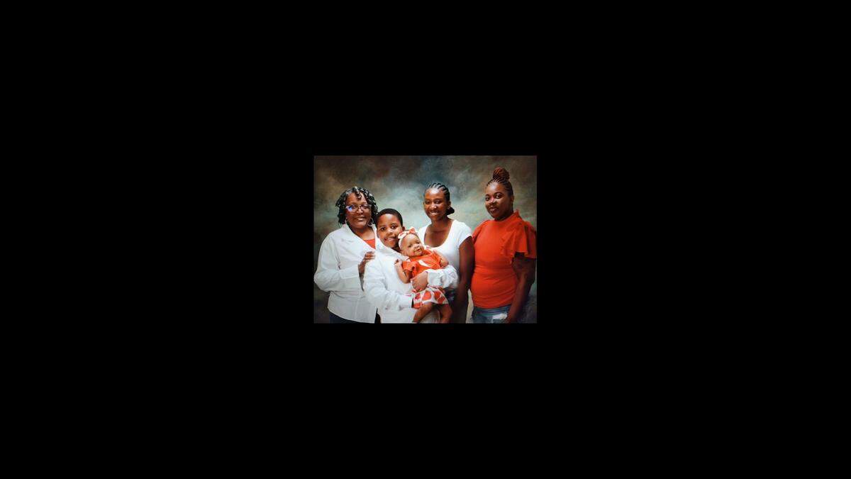 Elayjah Murray, center in white shirt, graduated from William Chrisman High School in Independence in May and was a freshman at Missouri State, studying nursing. She loved being around her family, loved ones said, making them laugh and using her chattiness to light up a room.