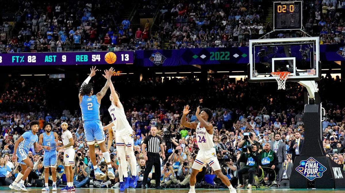 North Carolina Tar Heels guard Caleb Love misses a last second shot against Kansas Jayhawks guard Christian Braun during the 2022 NCAA championship game at Caesars Superdome on April 4, 2022.