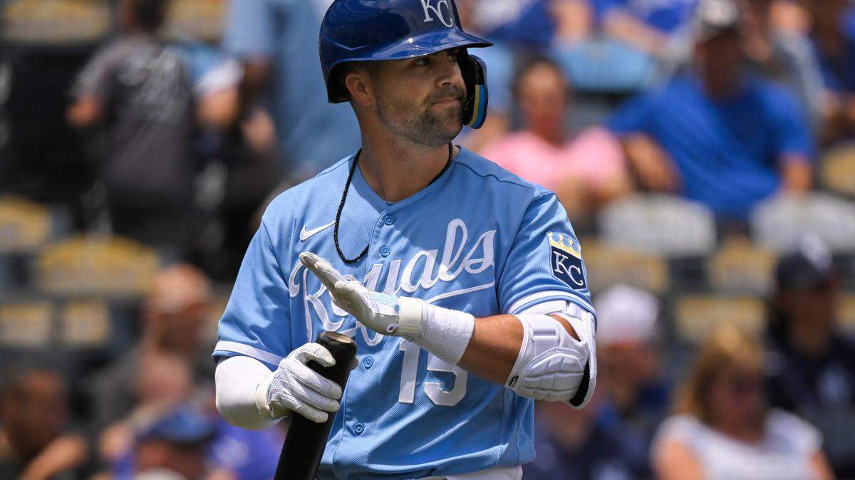 The Kansas City Royals’ Whit Merrifield walks back to the dugout after striking out against the Toronto Blue Jays during the first inning of a baseball game, Wednesday, June 8, 2022, in Kansas City, Mo. (AP Photo/Reed Hoffmann)