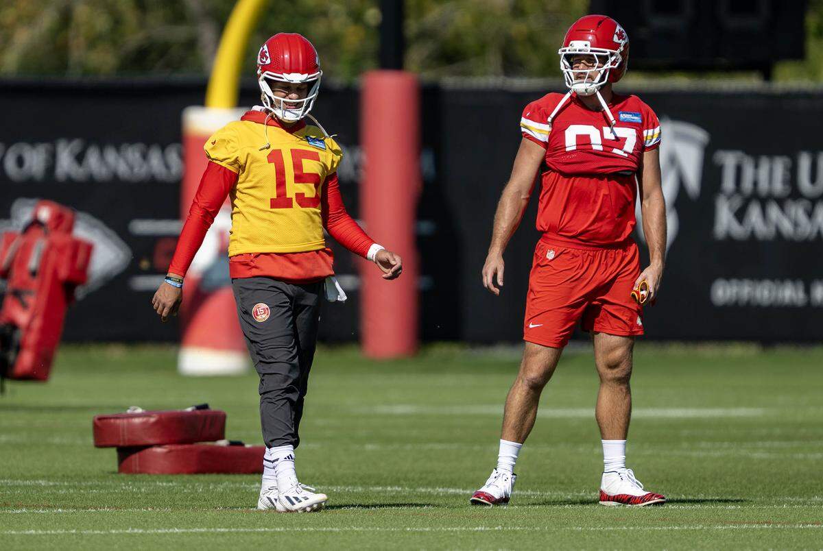 Chiefs quarterback Patrick Mahomes, left, and tight end Travis Kelce chat during practice at the team’s training facility on Thursday, Oct. 16, 2025, in Kansas City.