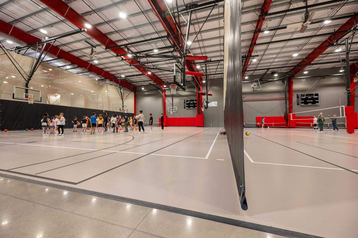 Kids participate in basketball and volleyball drills at TM Fieldhouse in Lee's Summit on Monday, December 29, 2025.
