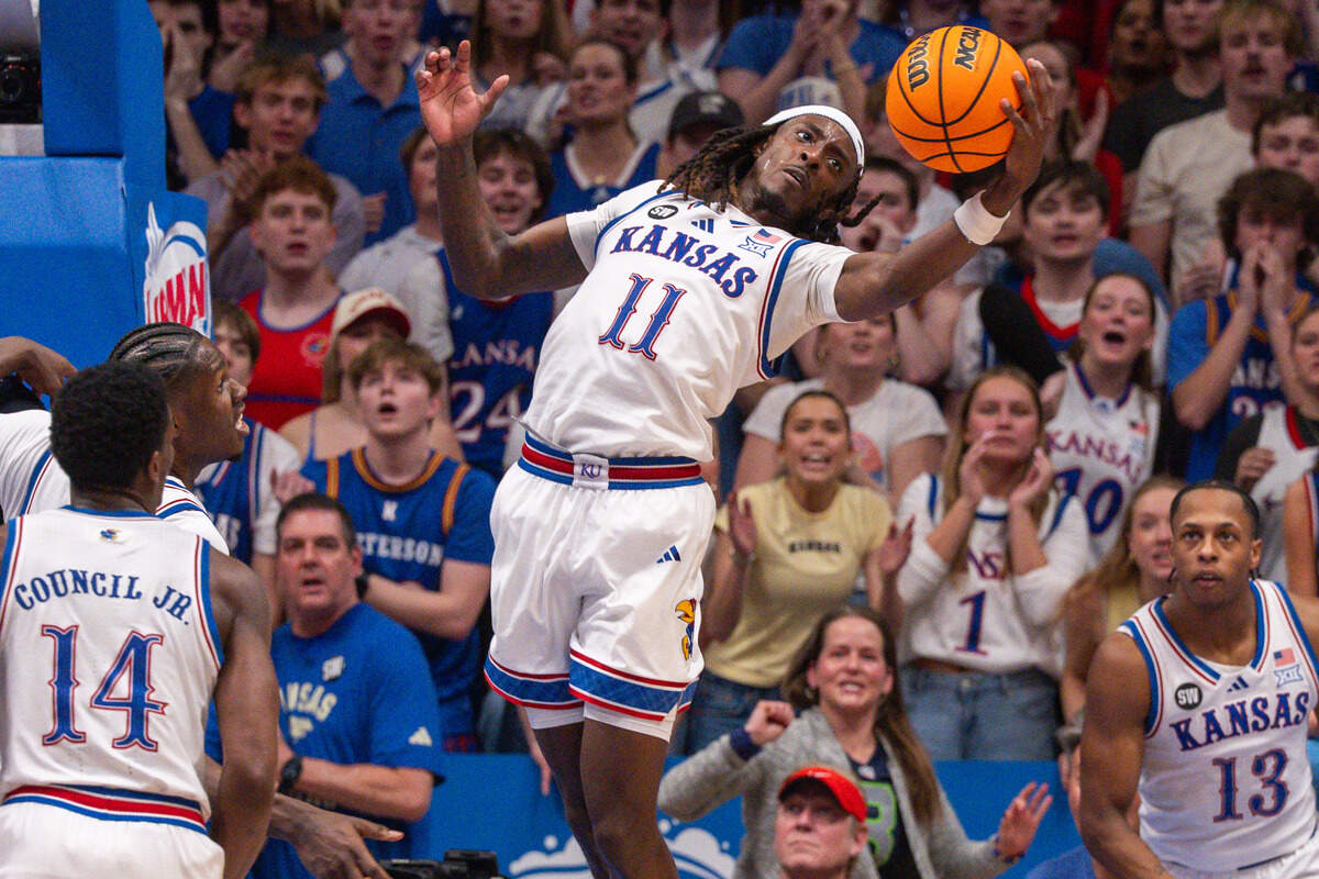 Kansas Jayhawks guard Jamari McDowell (11) grabs a rebound in the second half vs. the Arizona Wildcats on Monday, February 9, 2026, at Allen Fieldhouse.