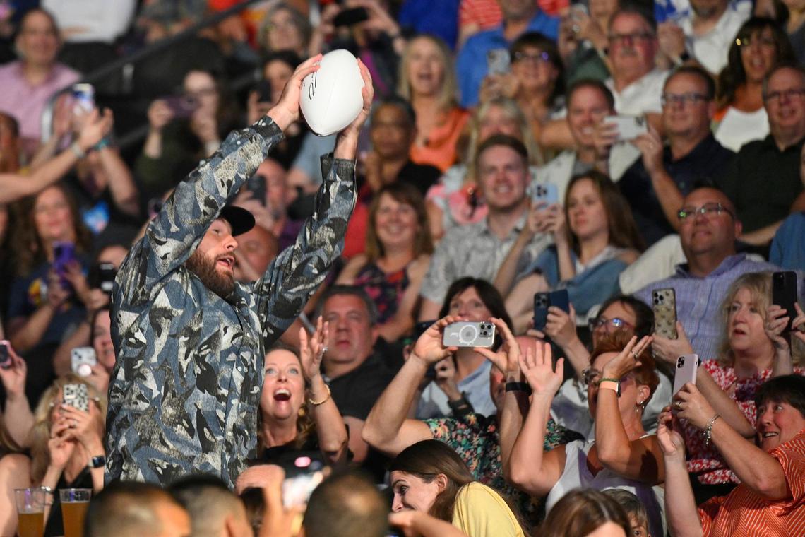 It may be the offseason, but Chiefs tight end Travis Kelce went to work catching passes from quarterback Patrick Mahomes. Each autographed ball sold for $15,000.