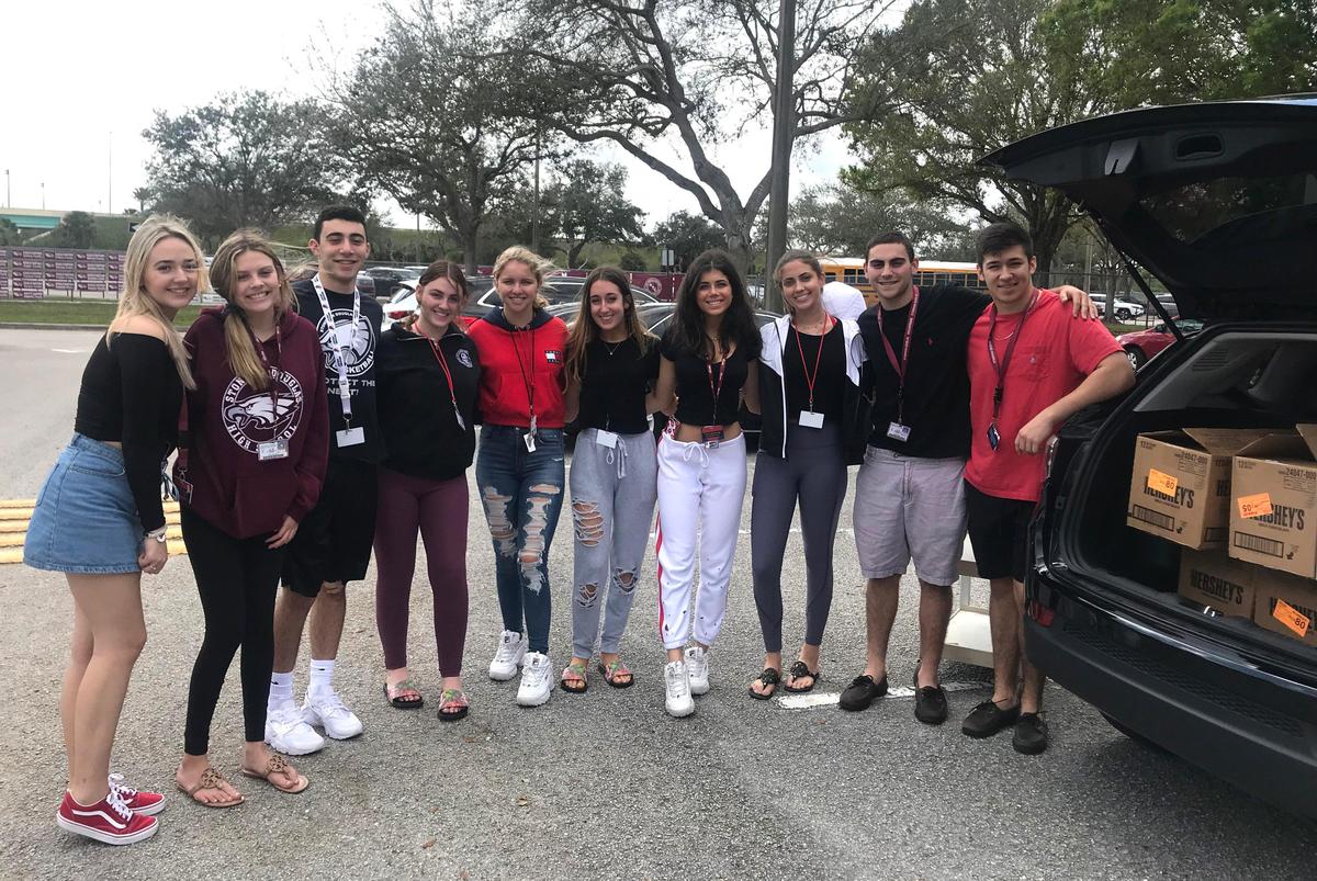 Students at Marjory Stoneman Douglas High School in Parkland, Fla., unloaded over 400 pounds of chocolate bars delivered by Missy Pint of Lenexa this week. The 3,550 bars were adorned with handwritten notes of love and inspiration to the students, staff and administrators there.