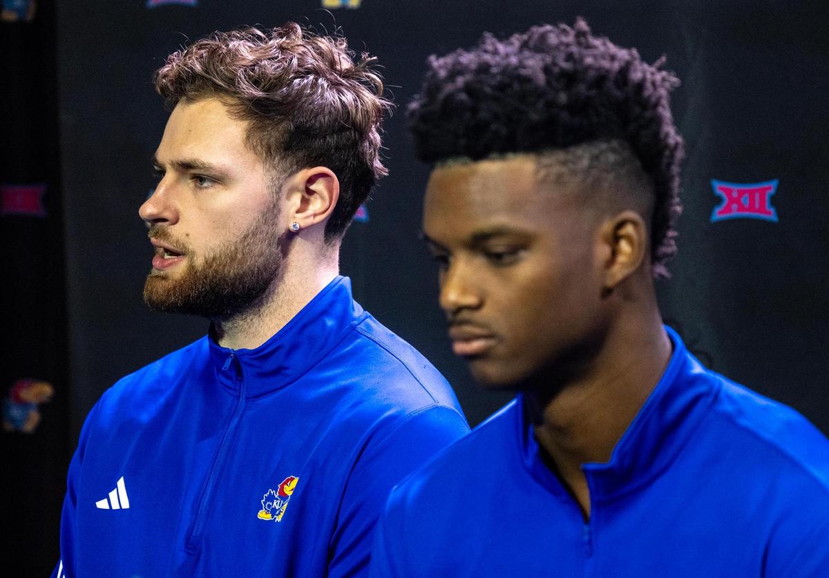 Kansas Jayhawks, from left, Hunter Dickinson and KJ Adams answer questions during Big 12 Men’s Basketball Media Day at T-Mobile Center on Wednesday, October 23, 2024, in Kansas City.