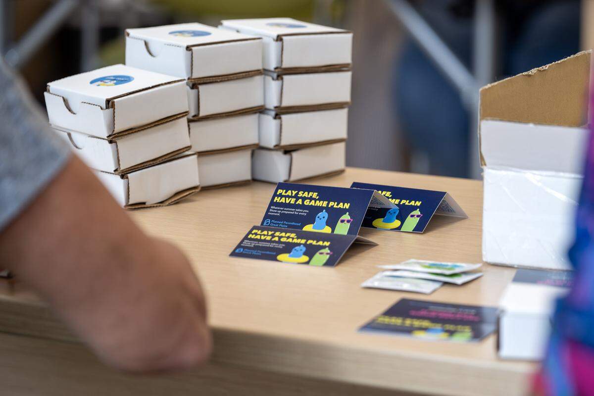 A Planned Parenthood resource card sits among supplies used to assemble safer-sex kits at Our Spot KC on Thursday, June 4, 2026, in Kansas City, Mo. Planned Parenthood aims to distribute 5,000 free kits during FIFA World Cup matches in the Kansas City area.
