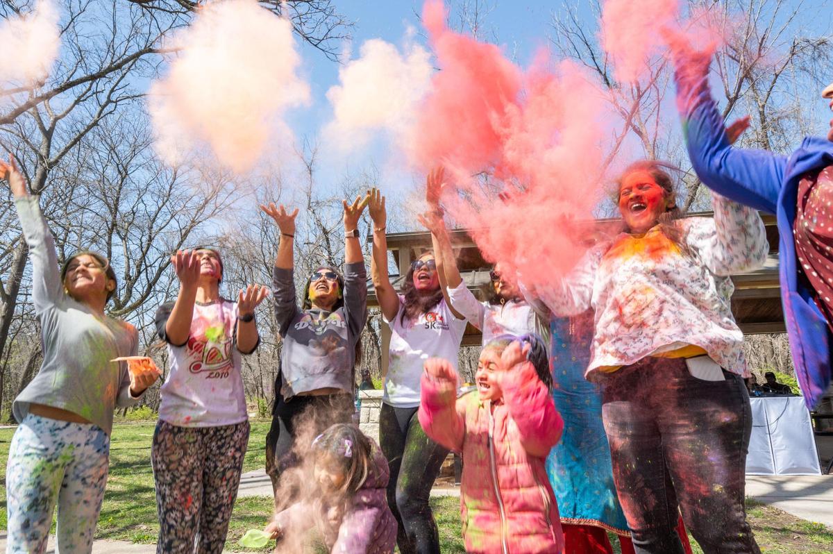 People celebrate the Hindu festival of Holi in Overland Park on Sunday.