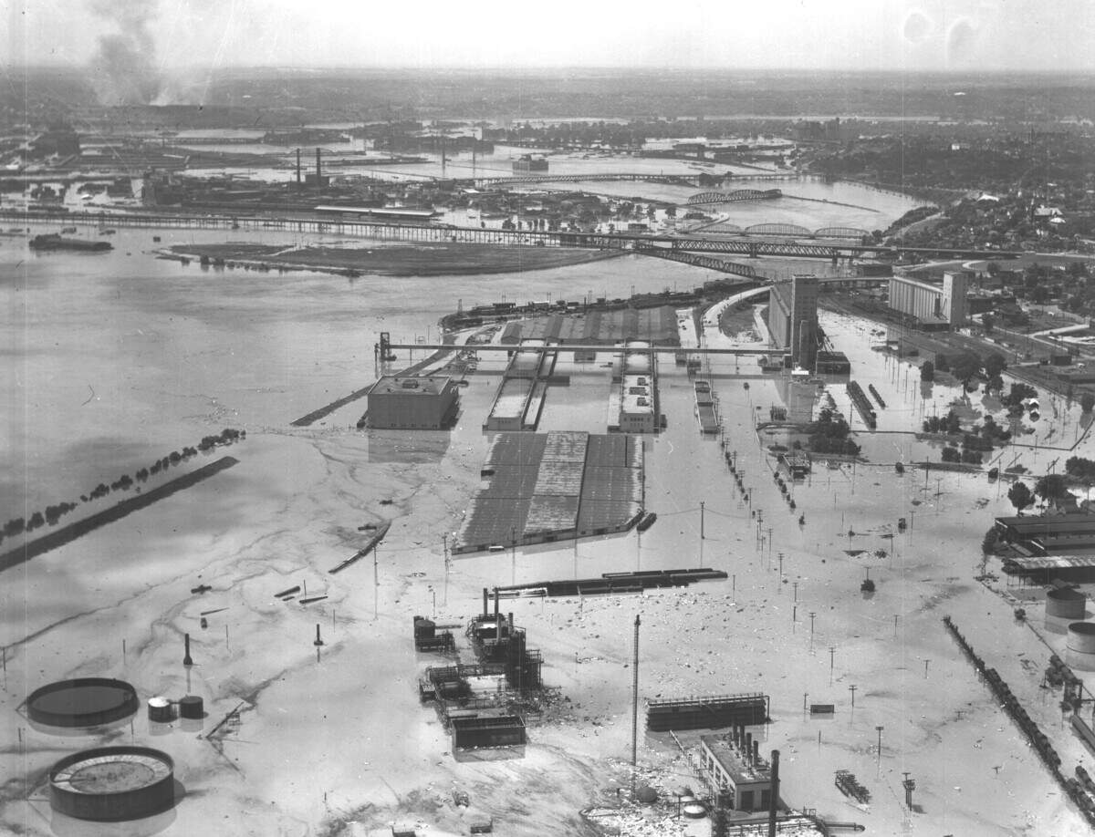 Fairfax Industrial District, looking south toward the confluence of the Kaw and Missouri rivers. Smoke from the fires along Southwest Boulevard is visible in the top left.