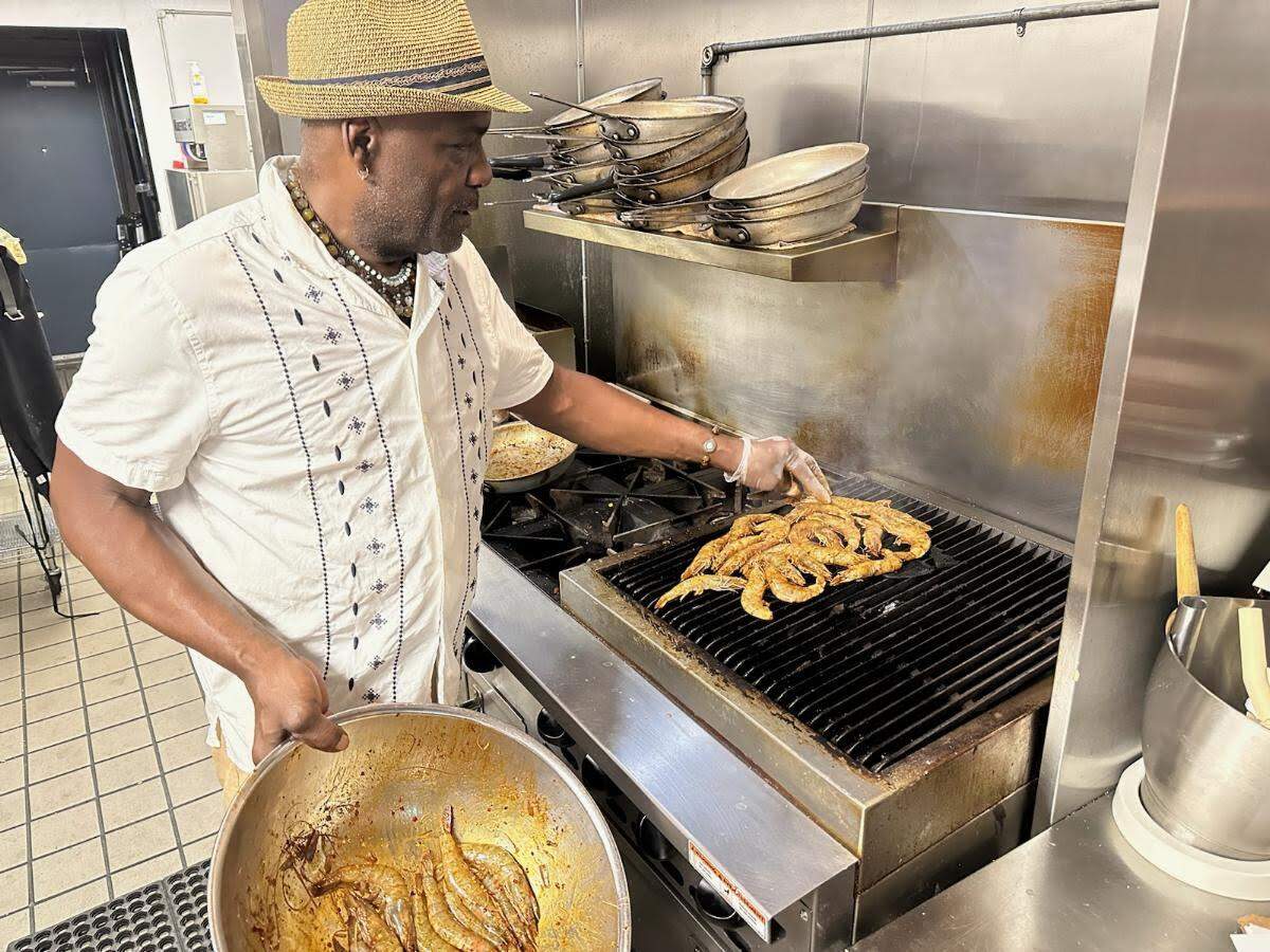 Sous chef Robert Burns grills shrimp at Bijou.