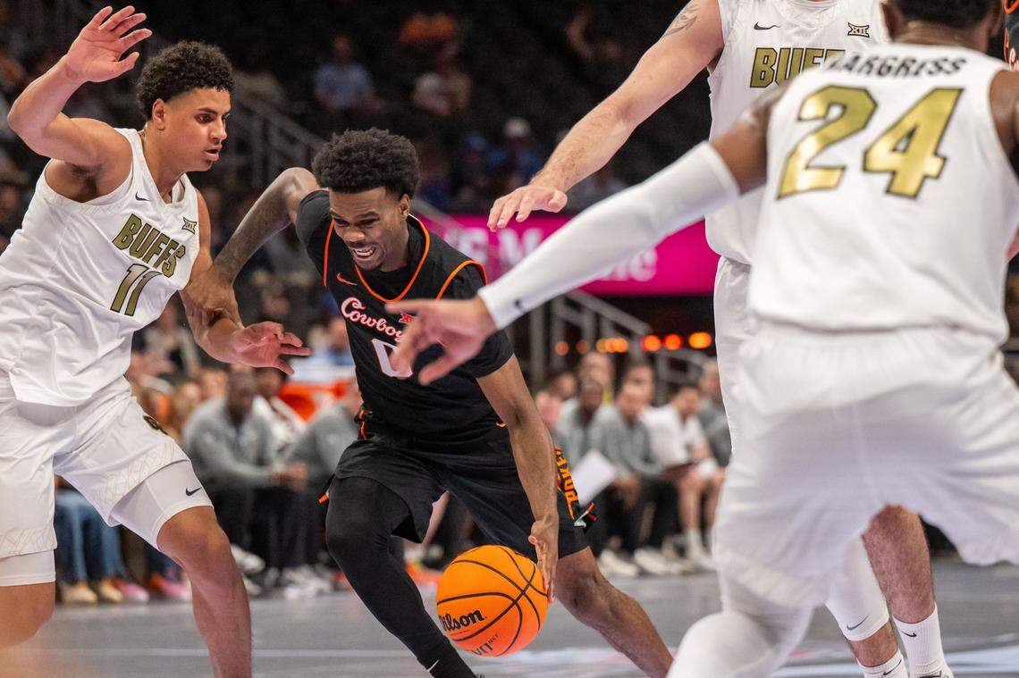 Oklahoma State Cowboys guard Jaylen Curry (0) dribbles through traffic in the second half of the Oklahoma State Cowboys first round game vs. the Colorado Buffaloes in the Big 12 Men's Basketball Tournament, on Tuesday, March 10, 2026, at T-Mobile Center.