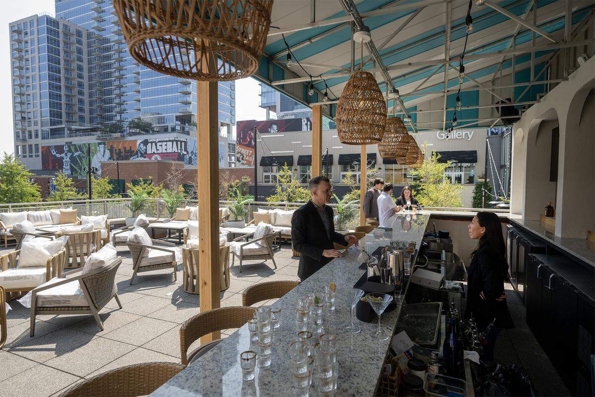 Palm Tree Club, a restaurant and bar featuring coastal vibe dinning, is opening this month at 14 E.14th Street in the Power &amp;amp;amp; Light District in Kansas City. The rooftop bar and outdoor lounge was seen on Thursday, Sept. 4, 2025, during a media preview.
