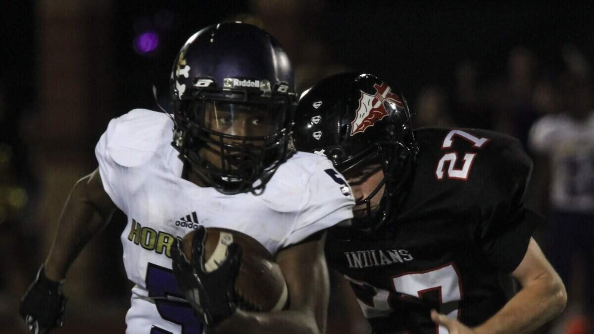 North Kansas City’s Brandon Hall got out in front of Fort Osage’s Trystan Floyd in Friday night’s game at Fort Osage.