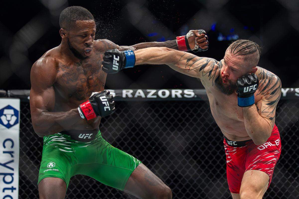 Nicolas Dalby, right, lands a punch on fellow UFC welterweight Randy Brown during their bout at the T-Mobile Center in Kansas City on Saturday night during UFC Fight Night: Machado Garry vs. Prates. Brown went on to win the fight.