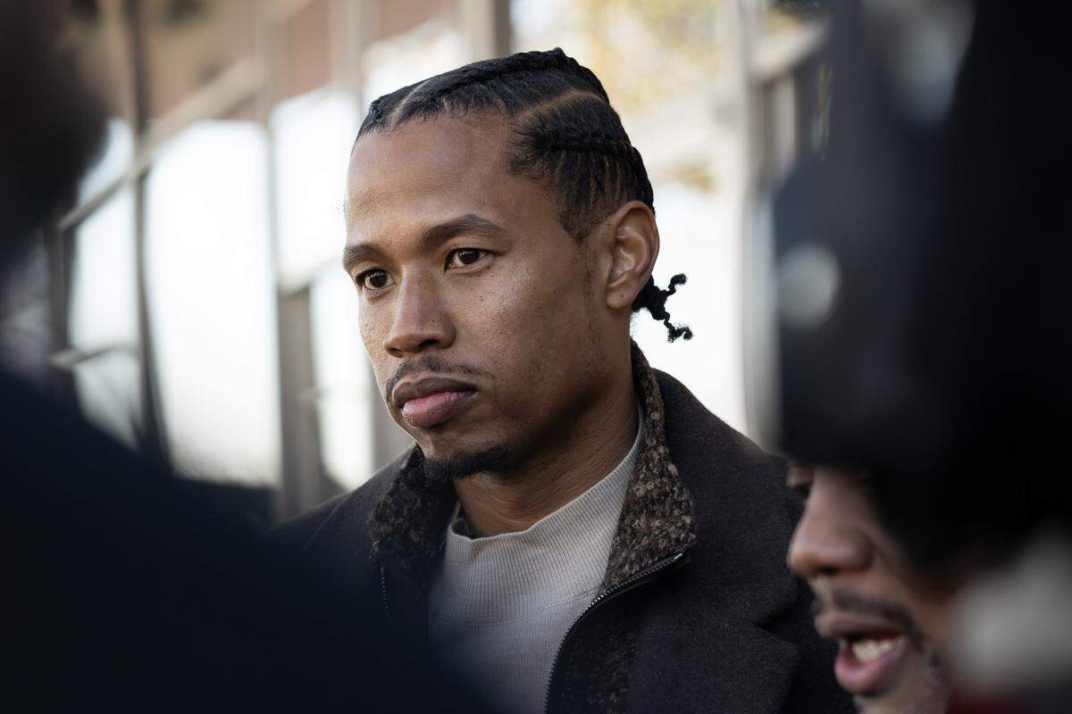 Christoper Lee, co-owner of Euphoric LLC, speaks to reporters after a press conference outside Holy Brunch on Monday, Dec. 8, 2025, in Kansas City. The event, organized by the Urban Council and other Black community organizations, addressed allegations of racial discrimination against Black-owned businesses in the Westport neighborhood.