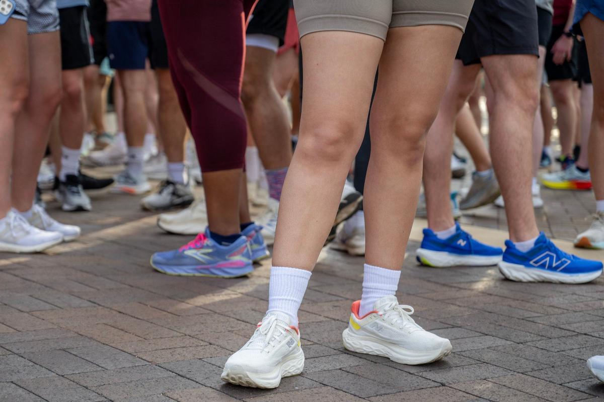 Runners wait for their Wednesday night run to begin.