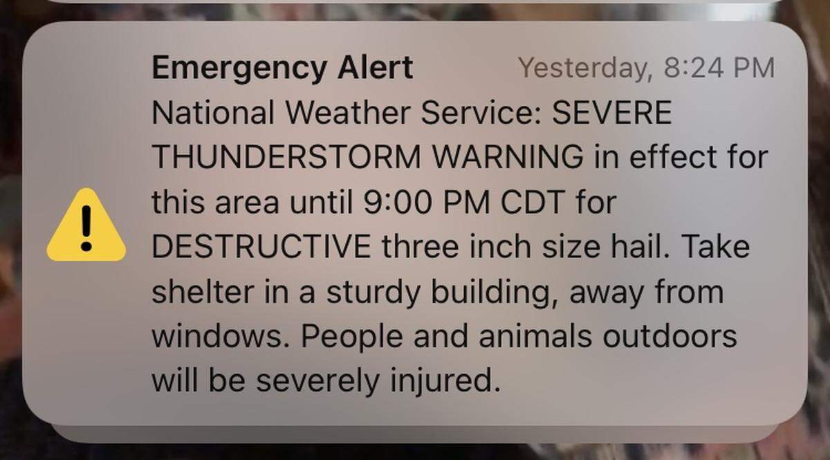 A mobile phone alert from the National Weather Service warned Kansas City area residents of extreme thunderstorm conditions and destructive hailstones on Wednesday, March 13, 2024.