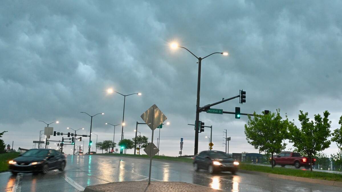Rain pours down amid severe thunderstorms and a flash flood warning at the intersection of 95th Street and Marshall Drive on Friday, April 17, in Lenexa.
