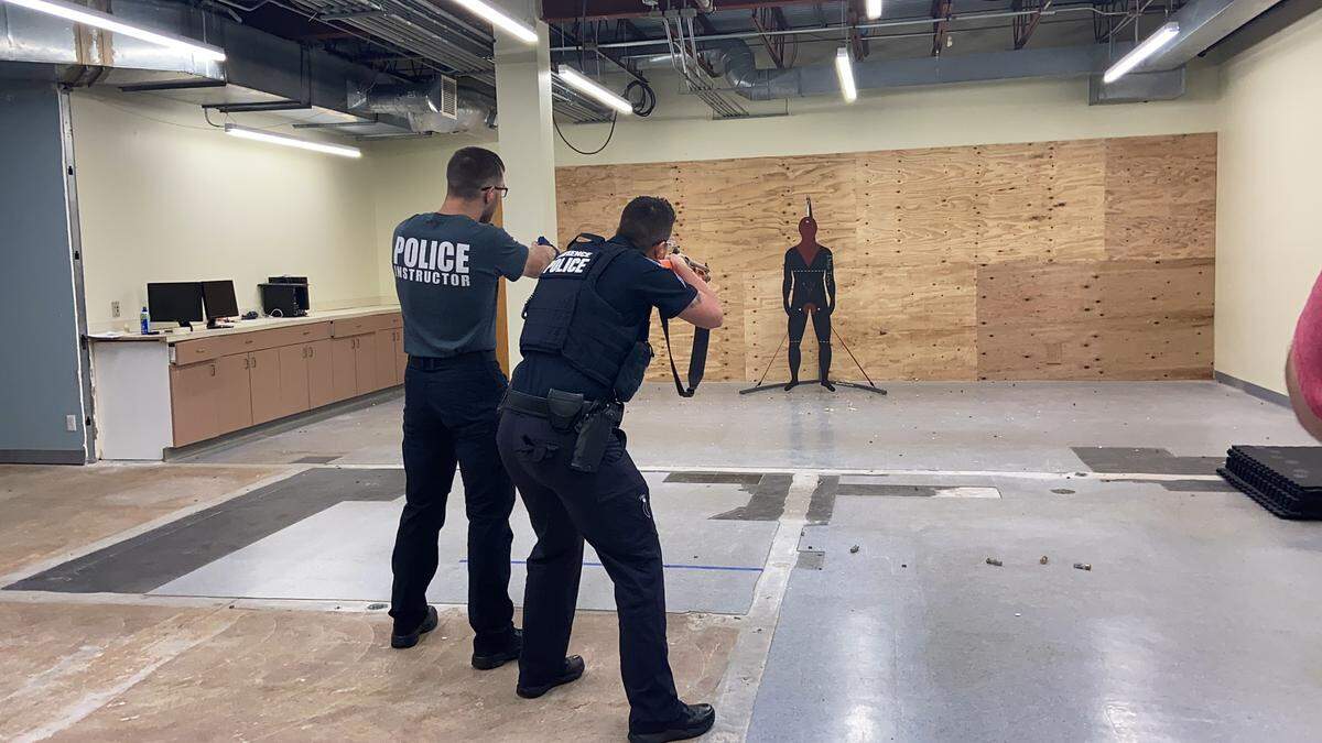 Lawrence police demonstrate the use of a beanbag gun on Thursday, July 21, 2022. The department transitioned from using shotguns to less-lethal beanbag guns.