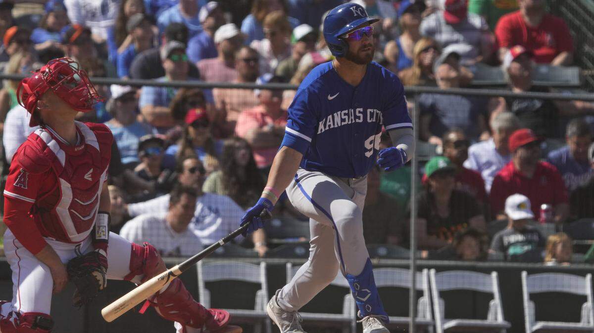 Mar 17, 2023; Tempe, Arizona, USA; Kansas City Royals right fielder John Rave hits a sacrifice RBI flyout against the Los Angeles Angels in the fourth inning at Tempe Diablo Stadium. Mandatory Credit: Rick Scuteri-USA TODAY Sports