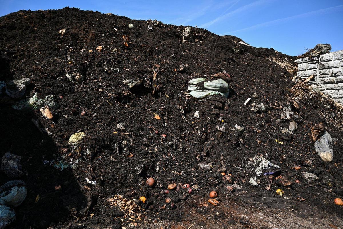A compost heap that was freshly turned shows food waste from curbside customers. The composting operation of Compost Collective KC is run by Dan Heryer and Brooke Salvaggio of URBAVORE Farm, a Kansas City urban farm. The goal of Compost Collective KC is to keep food waste out of landfills.