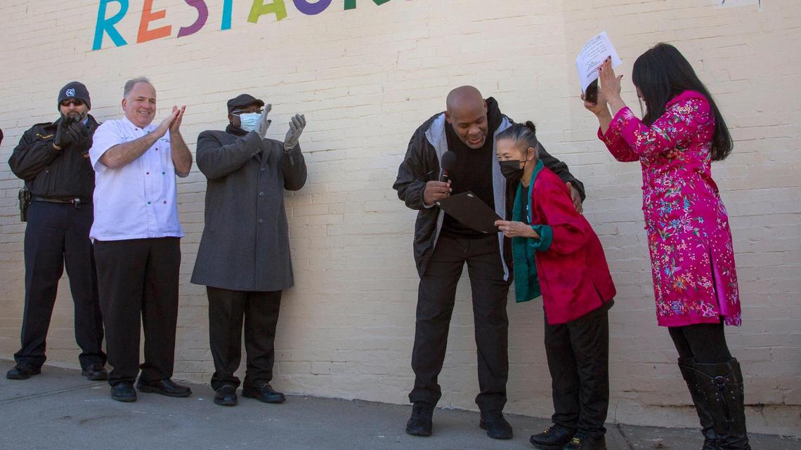 Kansas City, Kansas, Mayor Tyrone Garner presented Chef Annie Der and her daughter Tina Der a certificate during the 50th anniversary celebration of Tao Tao Chinese restaurant in Kansas City, Kansas, on Saturday, Feb. 12, 2022.