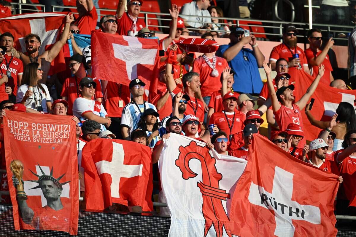Swiss fans wave flags to show their support before the Argentina vs. Switzerland 2026 World Cup Quarterfinal football match at Kansas City (Arrowhead) Stadium in Kansas City on Saturday, July 11, 2026.