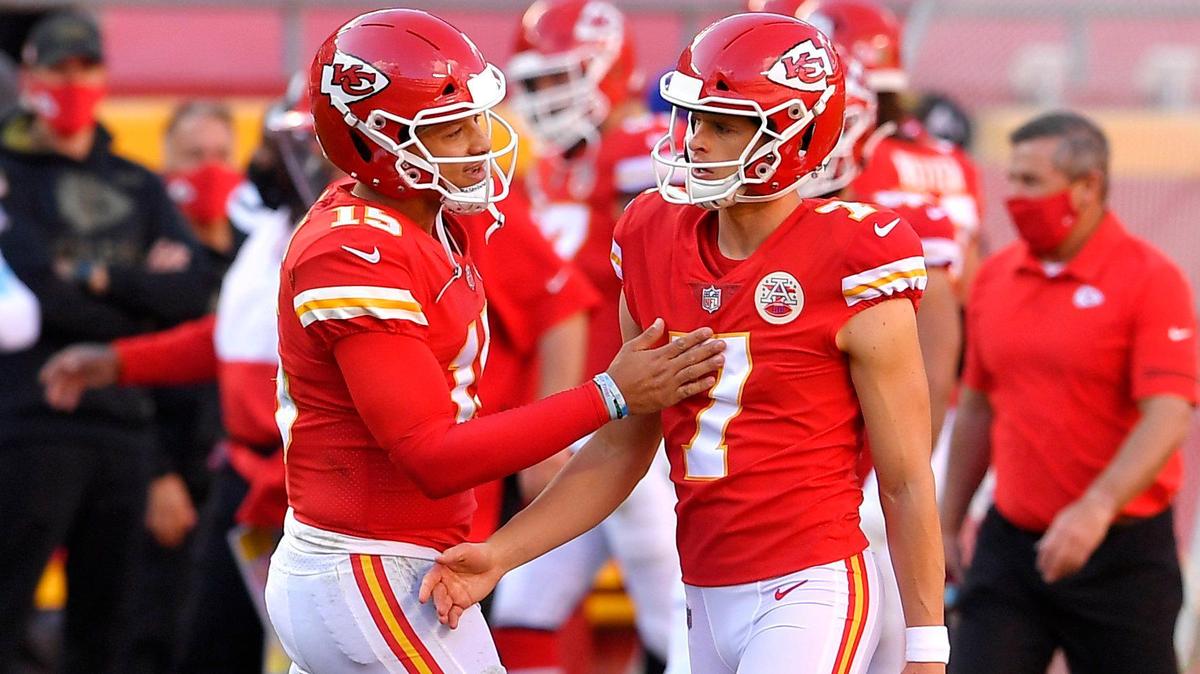 Chiefs quarterback Patrick Mahomes , left, chats with kicker Harrison Butker during a game in 2020.