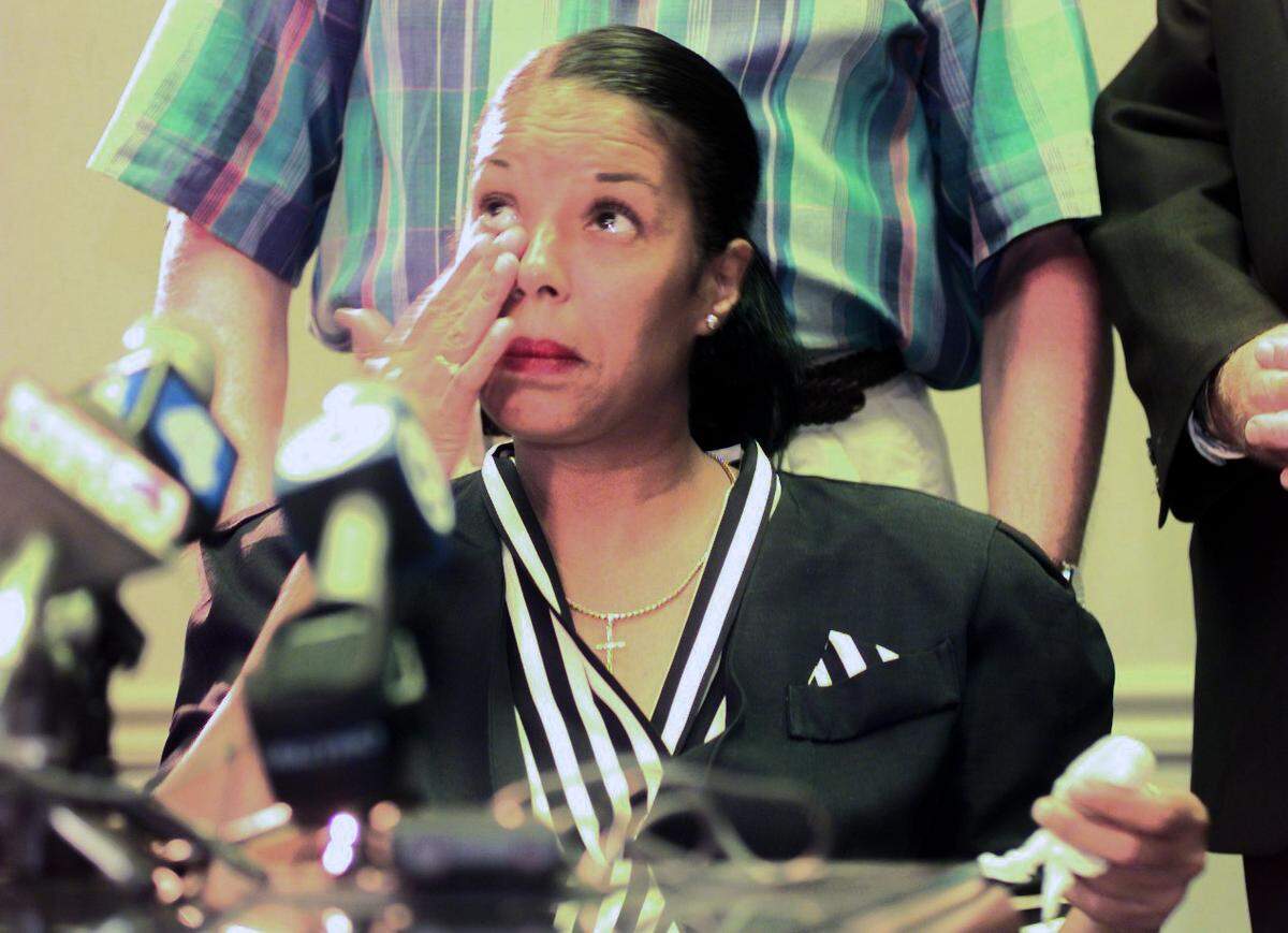 In a 1999 file photo, Ellen Reasonover, freed by a judge from a life sentence after serving 16 years in prison for a murder she did not commit, listened as her attorneys discussed her case at a news conference.
