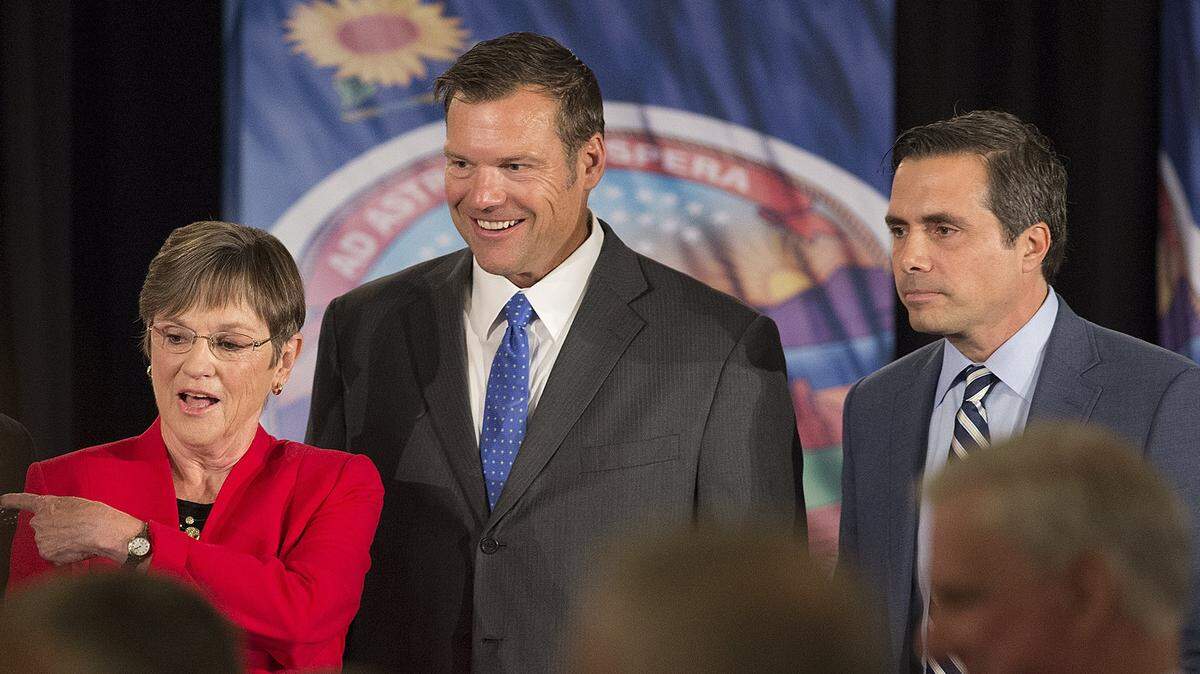 Kansas gubernatorial candidates Democrat Laura Kelly (from left), Republican Kris Kobach and Independent Greg Orman paused for a photo after a recent debate in Overland Park.