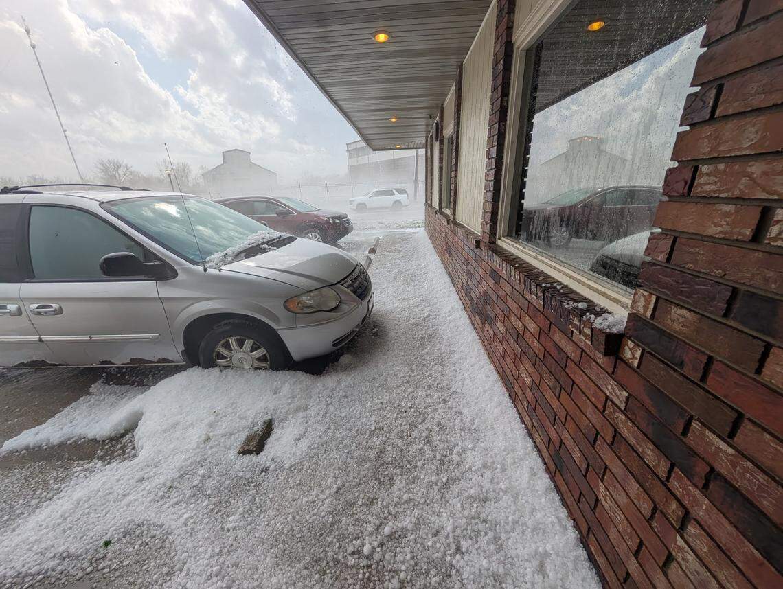 Hail collects outside Whistle Stop Cafe in Osawatomie on Wednesday, April 15, 2026.