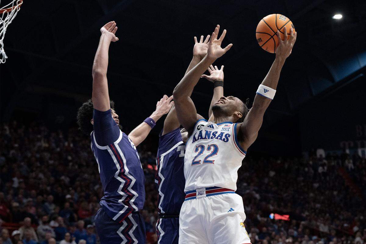 Kansas Jayhawks guard Darryn Peterson (22) shoots as a TCU player defends in the first half at Allen Fieldhouse in Lawrence on Tuesday, Jan. 6, 2025.