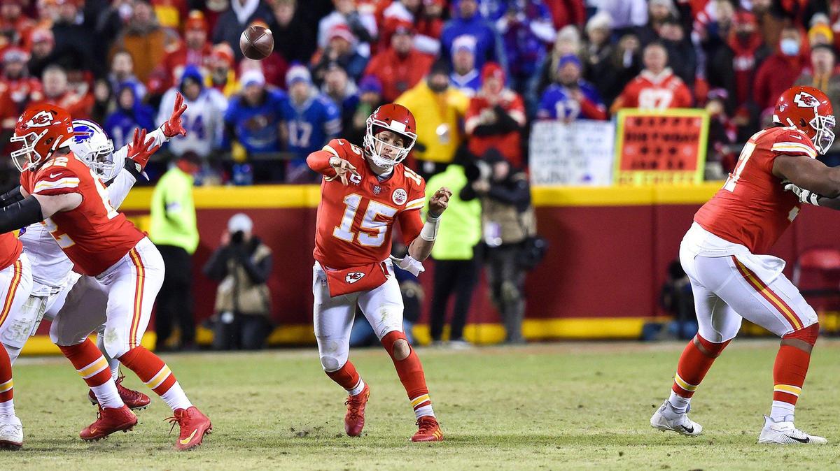 Kansas City Chiefs quarterback Patrick Mahomes throws to tight end Travis Kelce who gets the Chiefs in game-tying field goal territory with seconds left in the fourth quarter of the AFC Divisional Playoff game against the Buffalo Bills at GEHA Field at Arrowhead Stadium Sunday, Dec. 23, 2022. The Chiefs defeated the Bills in overtime, 42-36.