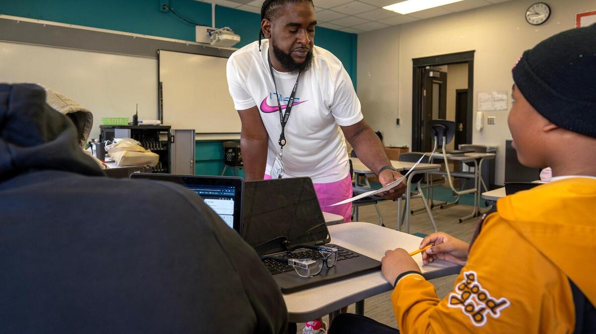 Vincent Gunnels helps students with their assignments during summer school at Central Middle on Monday, June 16, 2025, in Kansas City.