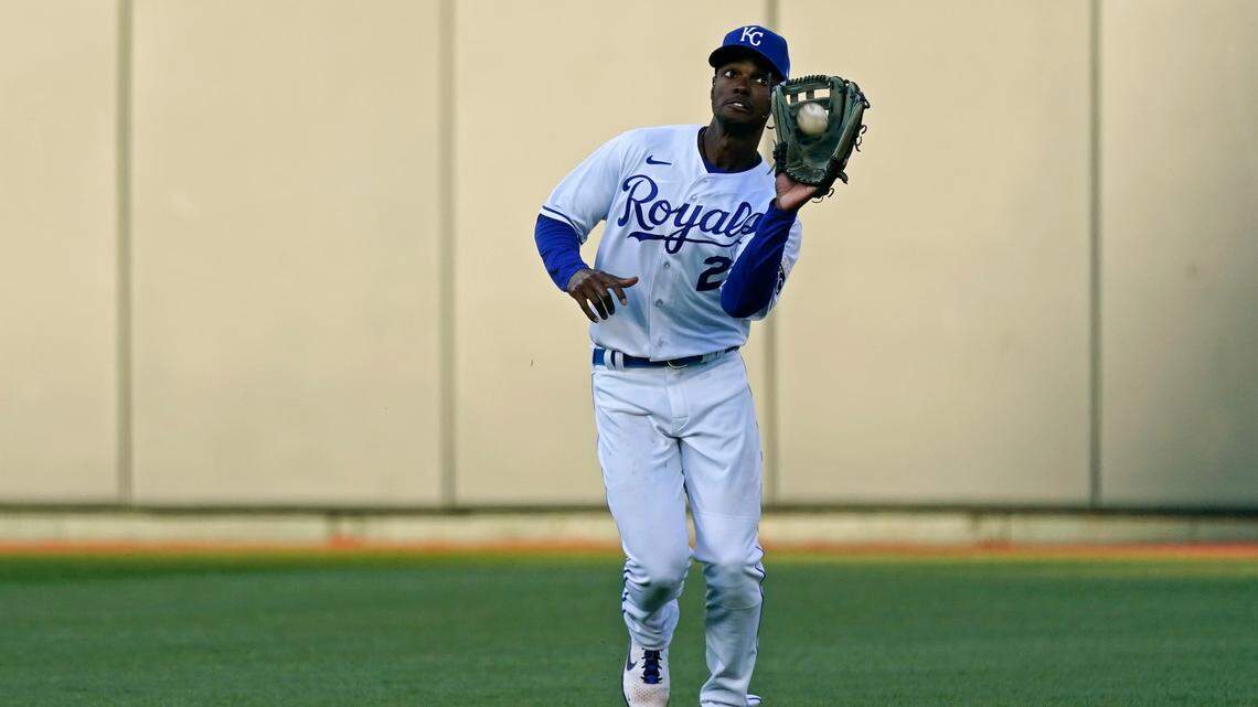 Kansas City Royals center fielder Michael A. Taylor catches a fly ball during the seventh inning of a baseball game against the Texas Rangers Thursday, April 1, 2021, in Kansas City, Mo. (AP Photo/Charlie Riedel)