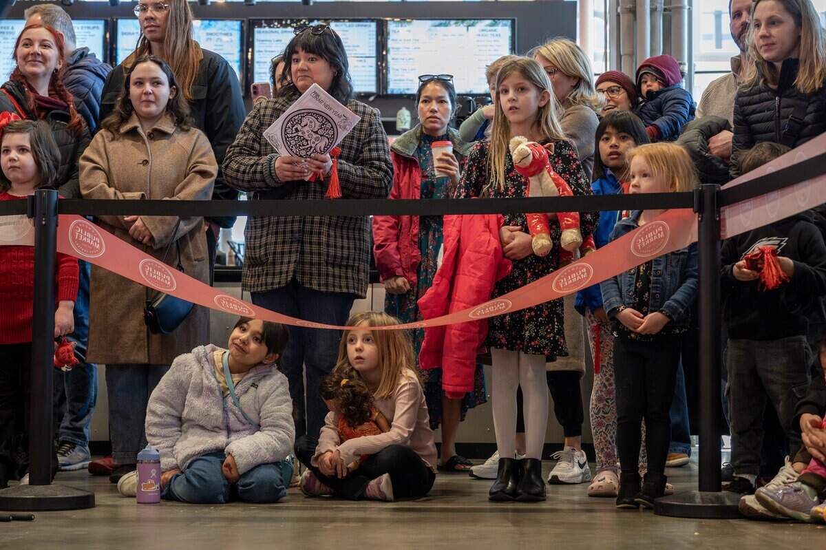 Guests watch a performance during a Lunar New Year celebration at the Lenexa Public Market on Sunday, Feb. 22, 2026, in Lenexa.