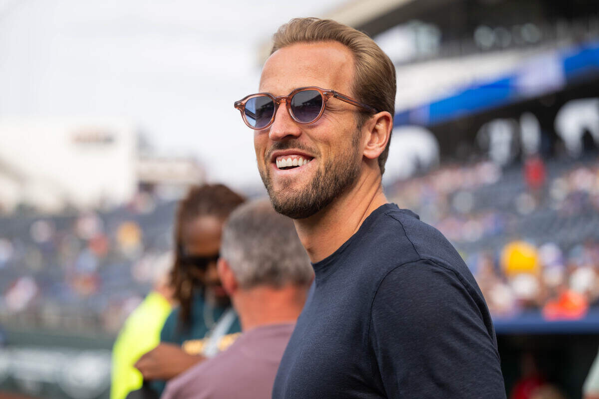 England national soccer team captain Harry Kane smiles while visiting the Royals ahead of their game against the St. Louis Cardinals at Kauffman Stadium in Kansas City on Thursday, June 18, 2026.