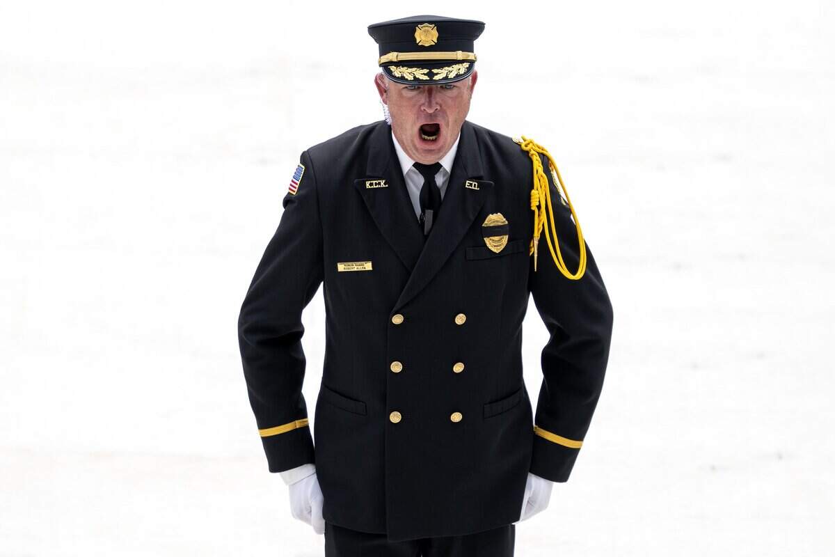 Robert Allen, honor guard commander, directs officers to change their positions following the funeral service for Deputy Elijah Ming at Children's Mercy Park on Monday, Aug. 11, 2025, in Kansas City.