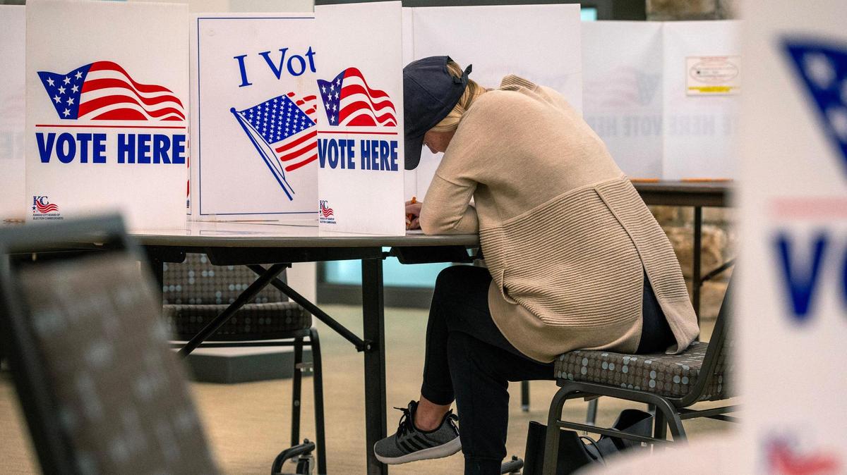 A voter casts their ballot for the general election at Country Club Christian Church on Tuesday, Nov. 5, in Kansas City.