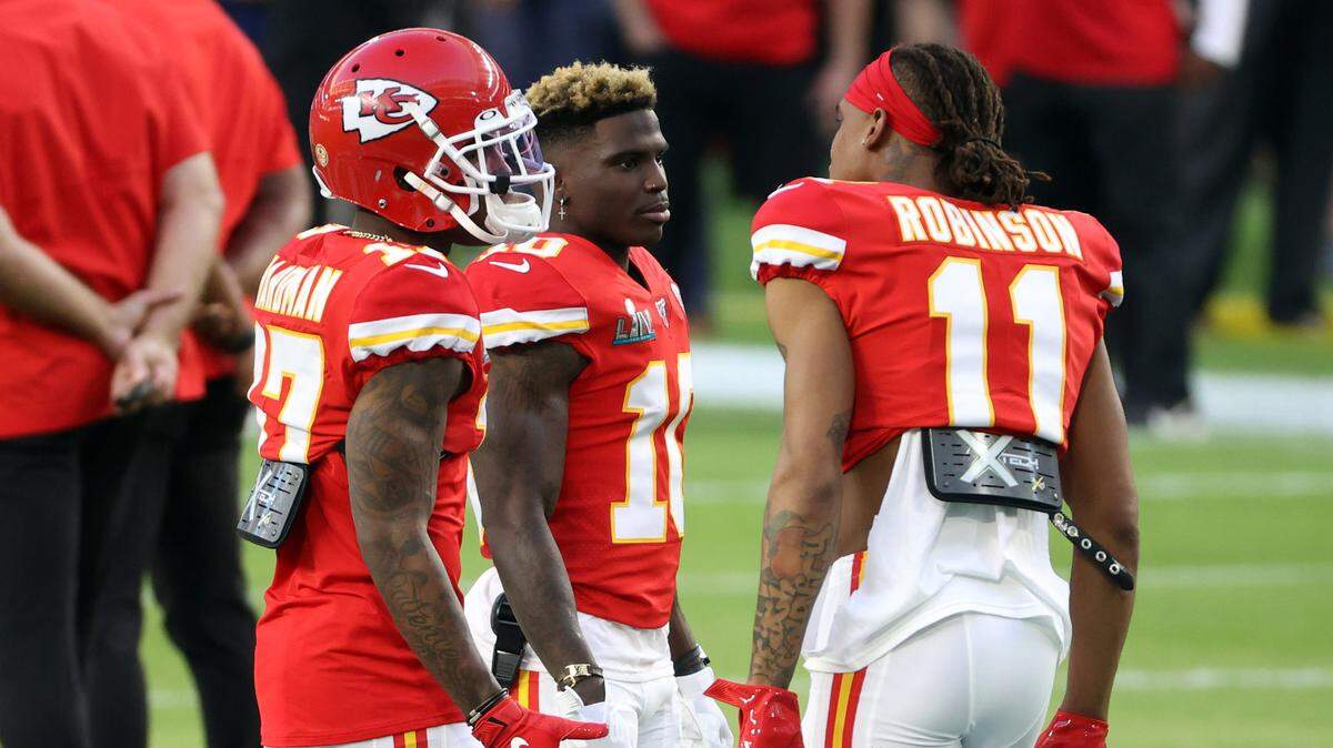 Kansas City Chiefs wide receiver Mecole Hardman (17), Chiefs wide receiver Tyreek Hill (10) and Chiefs wide receiver Demarcus Robinson (11) talk on the field prior to the Super Bowl LIV against the San Francisco 49ers at Hard Rock Stadium.