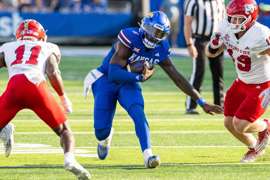 Kansas Jayhawks quarterback Jalon Daniels (6) makes a move in the open field in the first half of the game vs. the Fresno State Bulldogs on Saturday, Aug. 23, 2025, at David Booth Kansas Memorial Stadium, in Lawrence.