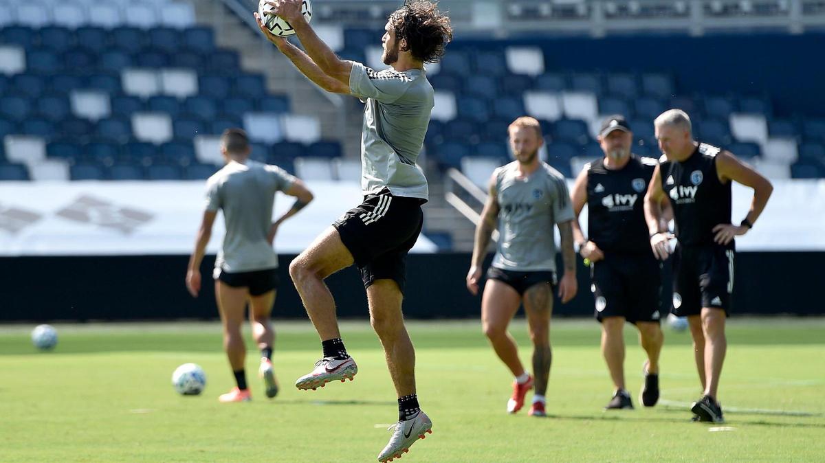 Defender Graham Zusi catches a ball at the end of practice at Children’s Mercy Park Monday, Aug. 24, 2020. Sporting Kansas City returns to the park Tuesday for the first time since the home opener March 7. Fans will be allowed in the park, but it will look different due to rules in place to prevent the spread of COVID-19.