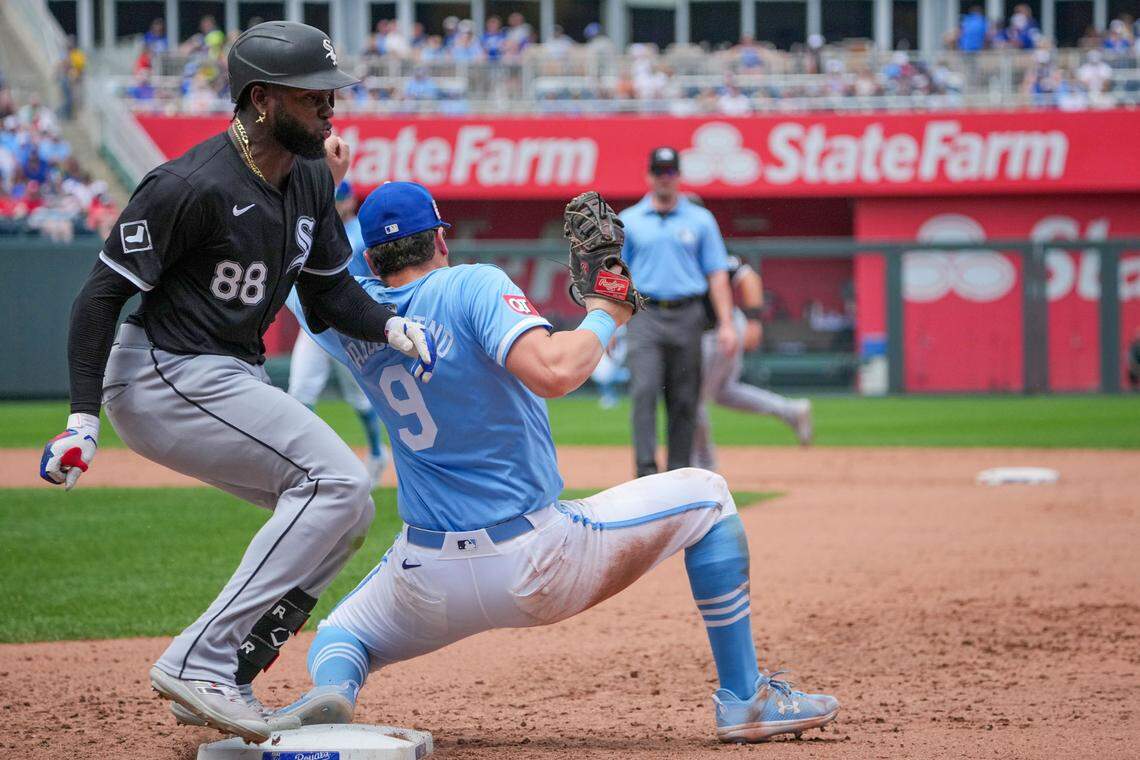 Kansas City Royals first base Vinnie Pasquantino holds onto the throw for a putout against Chicago White Sox center fielder Luis Robert Jr. during Sunday’s game at Kauffman Stadium.