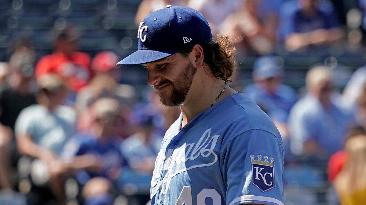 Kansas City Royals starting pitcher Jonathan Heasley walks to the dugout after coming out of the game during the second inning against the Cleveland Guardians on Saturday, July 9, 2022 at Kauffman Stadium in Kansas City.