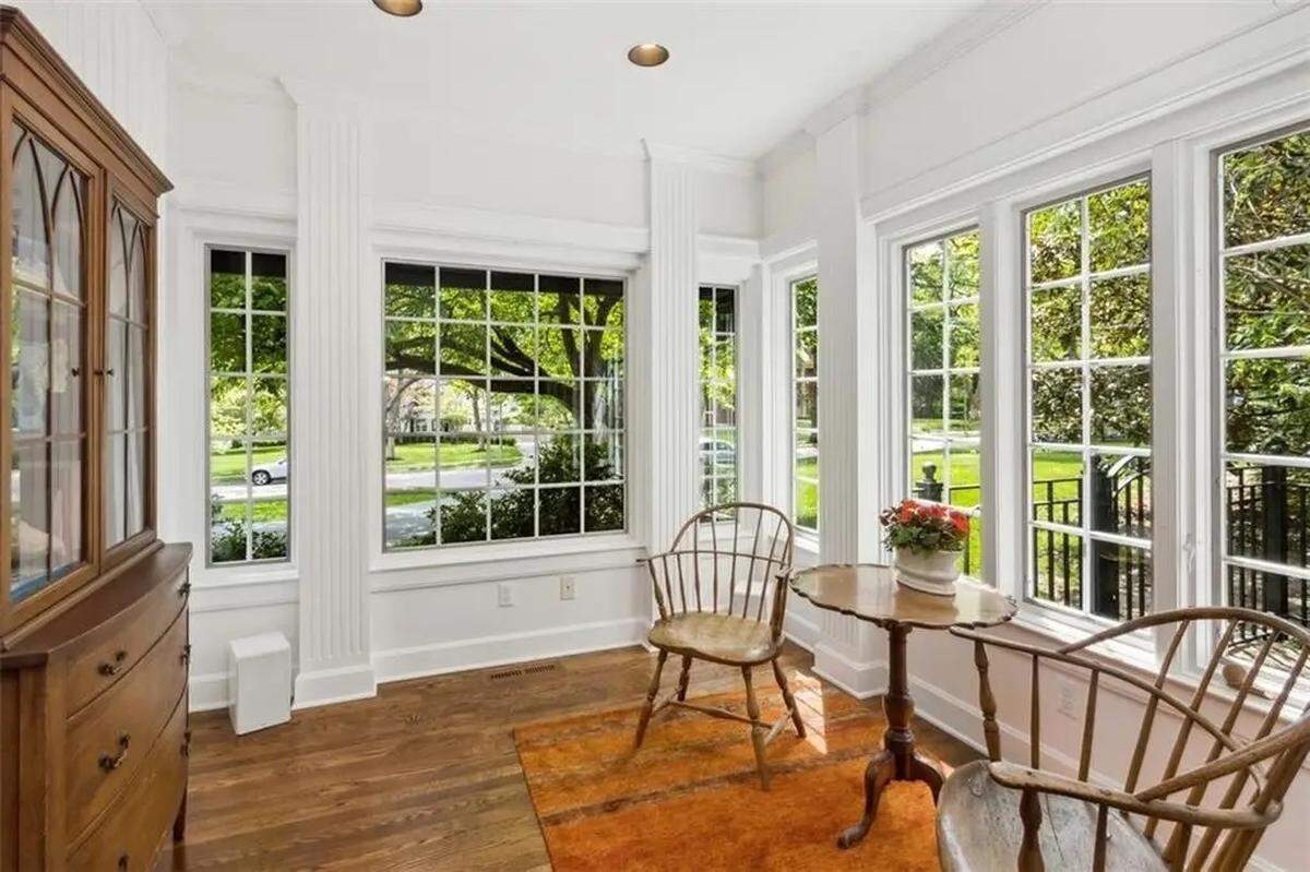 The sunroom at a Tudor-style home near Loose Park is seen in a Zillow screenshot.