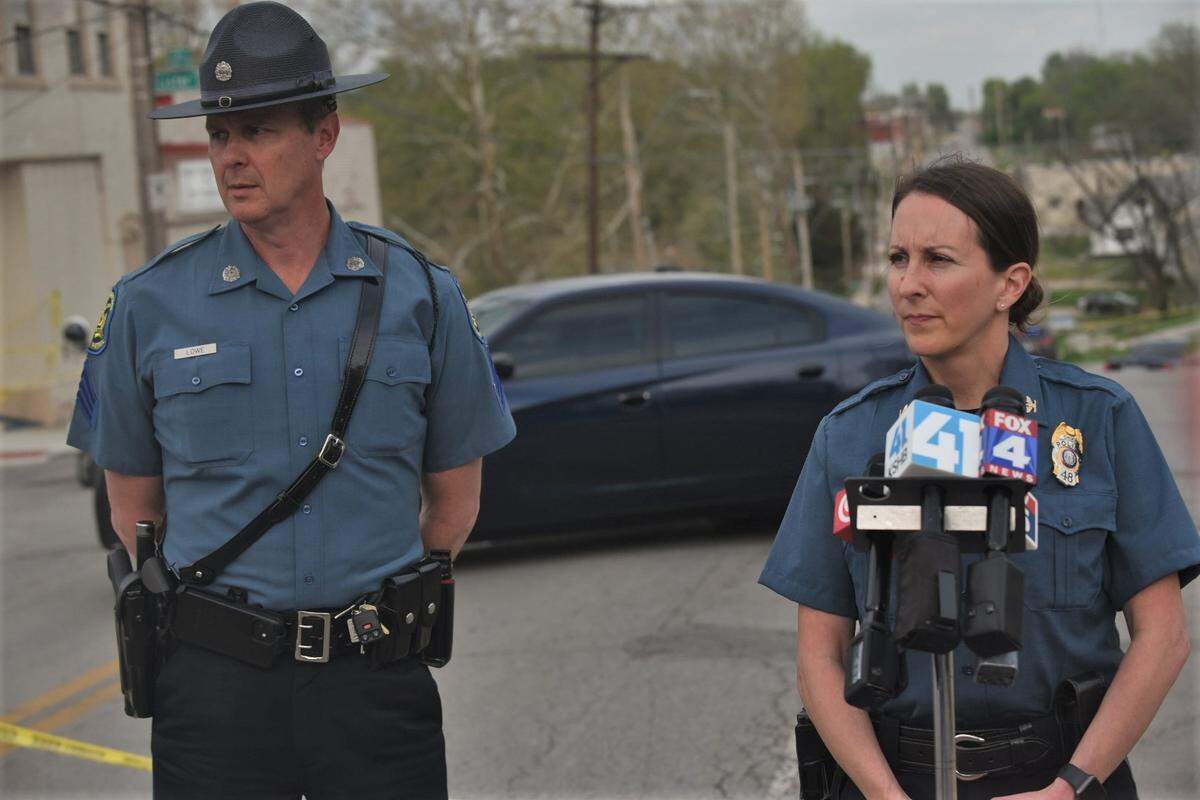 Kansas City Police Chief Stacey Graves, right, and Missouri State Highway Patrol Sgt. Bill Lowe, left, prepare to brief news reporters Wednesday near 27th Street and Lister Avenue after officers fatally shot a man who was allegedly armed with a handgun.