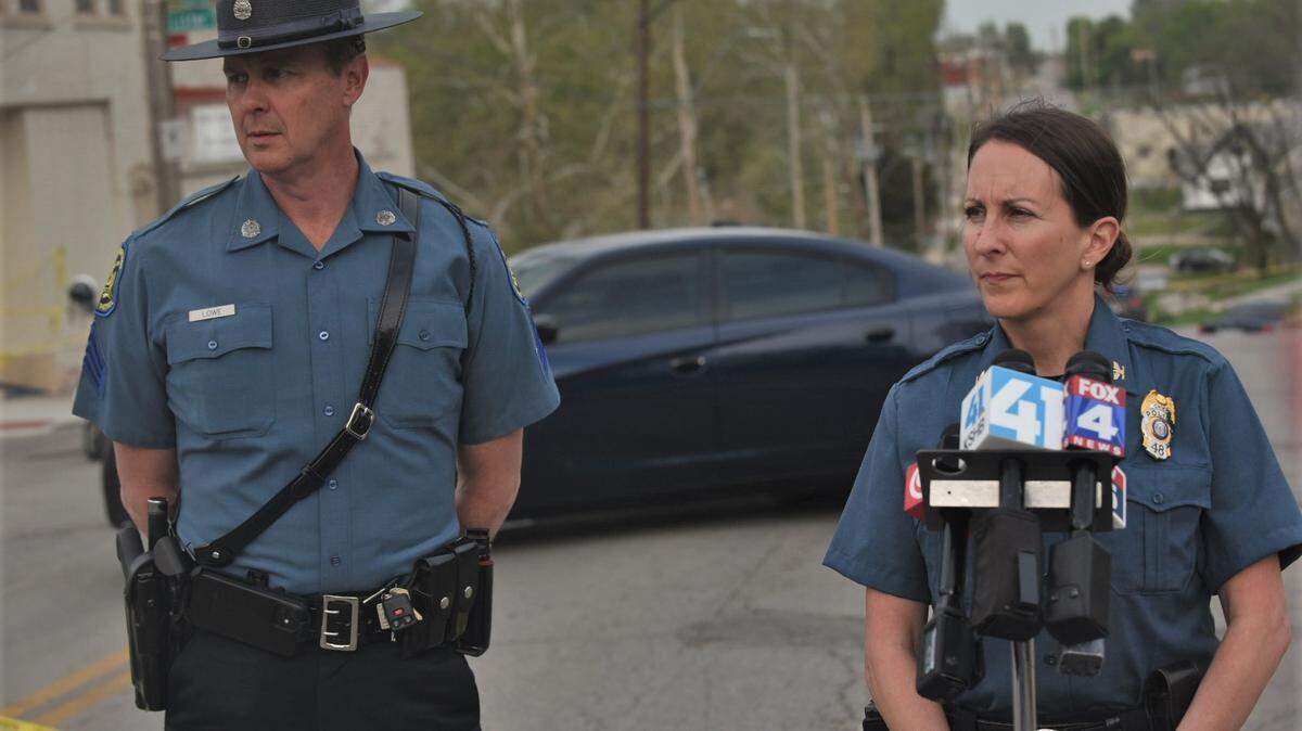 Kansas City Police Chief Stacey Graves, right, and Missouri State Highway Patrol Sgt. Bill Lowe, left, prepare to brief news reporters Wednesday near 27th Street and Lister Avenue after police fatally shot a man who was allegedly armed with a handgun.