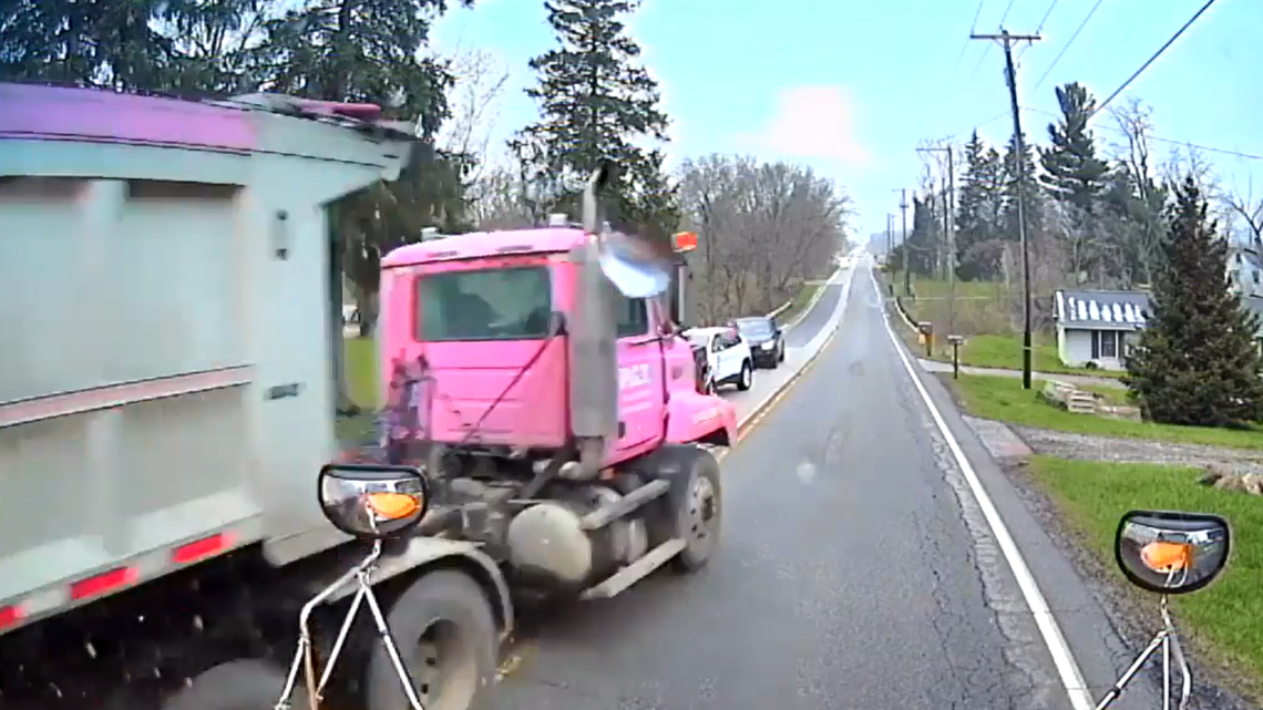A trucker narrowly misses a school bus, after losing control on the road in Ohio.