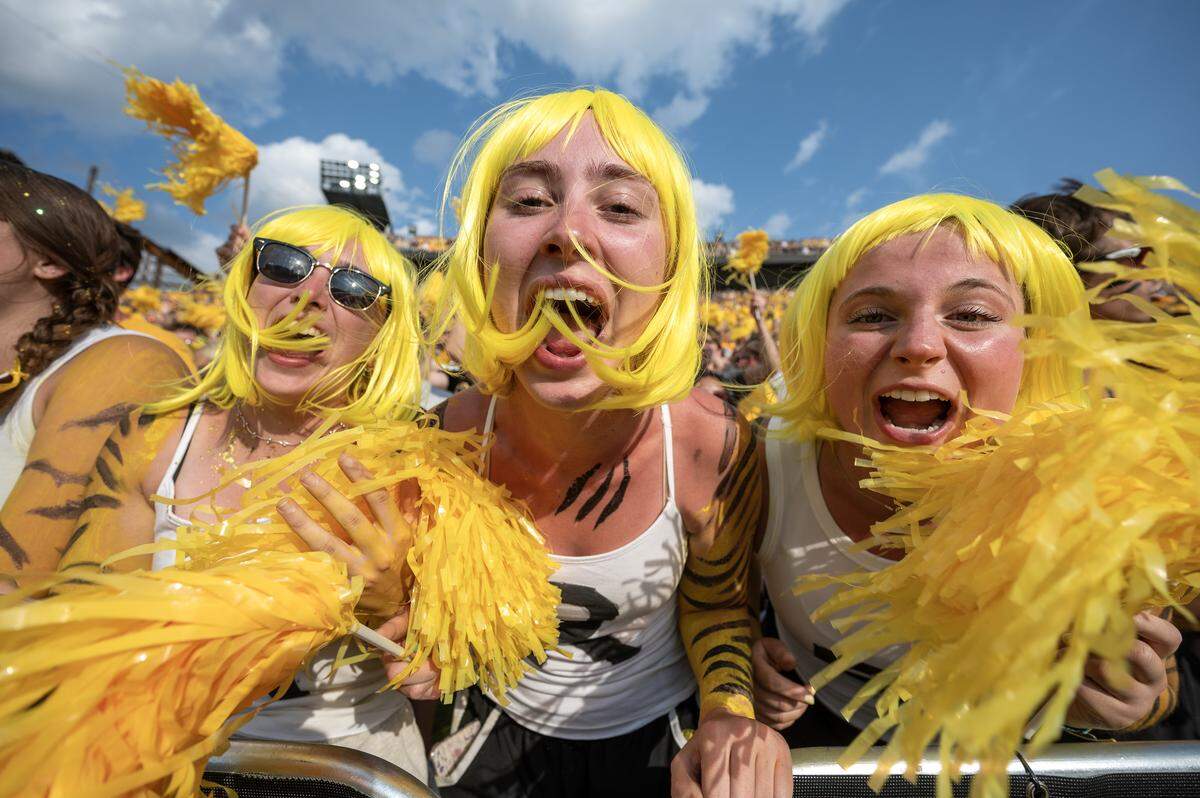 Hayley Conklin, Jenna Patterson and Taylor Hinds participate in a singalong to “Mr. Brightside” during a timeout in a game between the Missouri Tigers and Kansas Jayhawks at Faurot Field at Memorial Stadium on Saturday, Sept. 6, 2025, in Columbia.