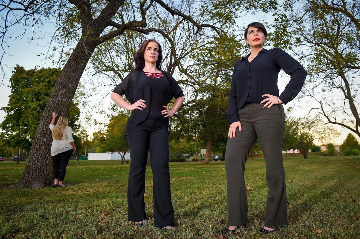 Survivors of domestic violence, Shannon Joy, center, and Janice Thompson, right, met with another survivor of domestic violence near the Victims Memorial Garden in Phelps Grove Park in Springfield, Missouri. Springfield consistently has the highest rate of domestic violence incidents in Missouri. Thompson, who was brutally assaulted by her ex-husband, is now an advocate for victims of domestic violence. She was honored for her advocacy with a brick in the garden which honors victims of crimes as well as advocates.