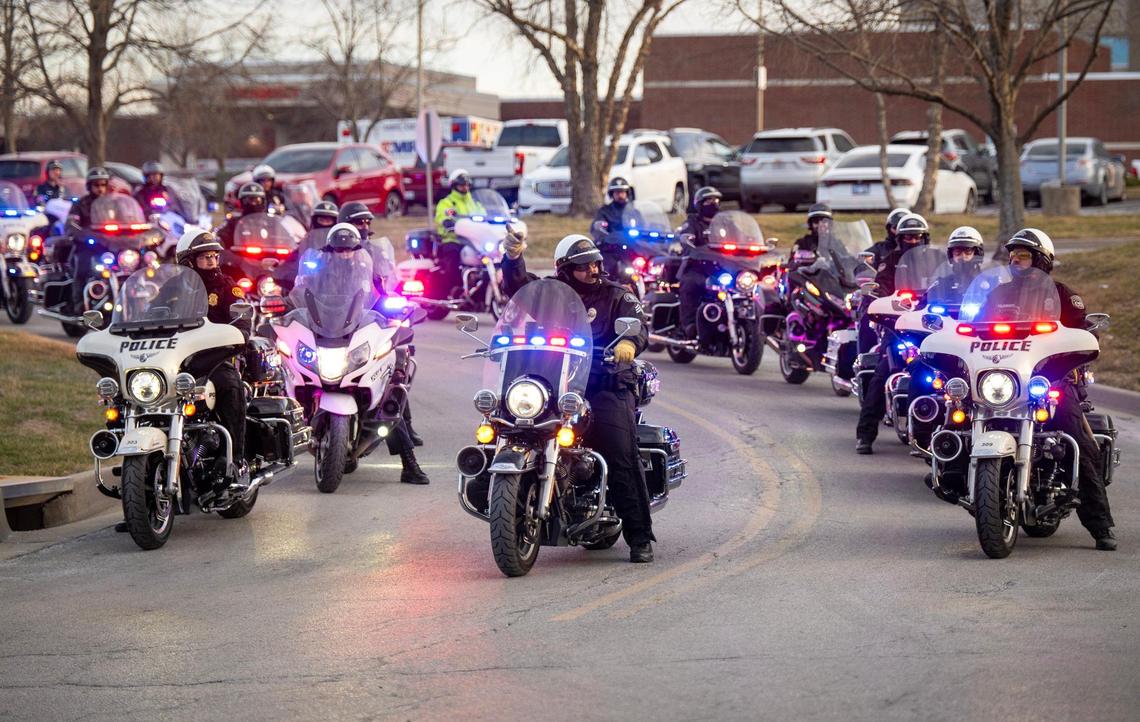 Police vehicles line up for a procession to escort the body of fallen Independence police officer Cody Allen from Centerpoint Medical Center to the medical examiner’s office on Thursday, Feb. 29, 2024, in Independence. Allen was shot and killed in the line of duty hours earlier who in the northeast part of the city.